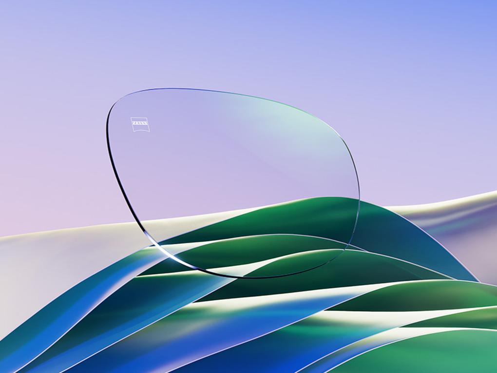 En CGI illustration af et klart brilleglas med en blød grøn refleks