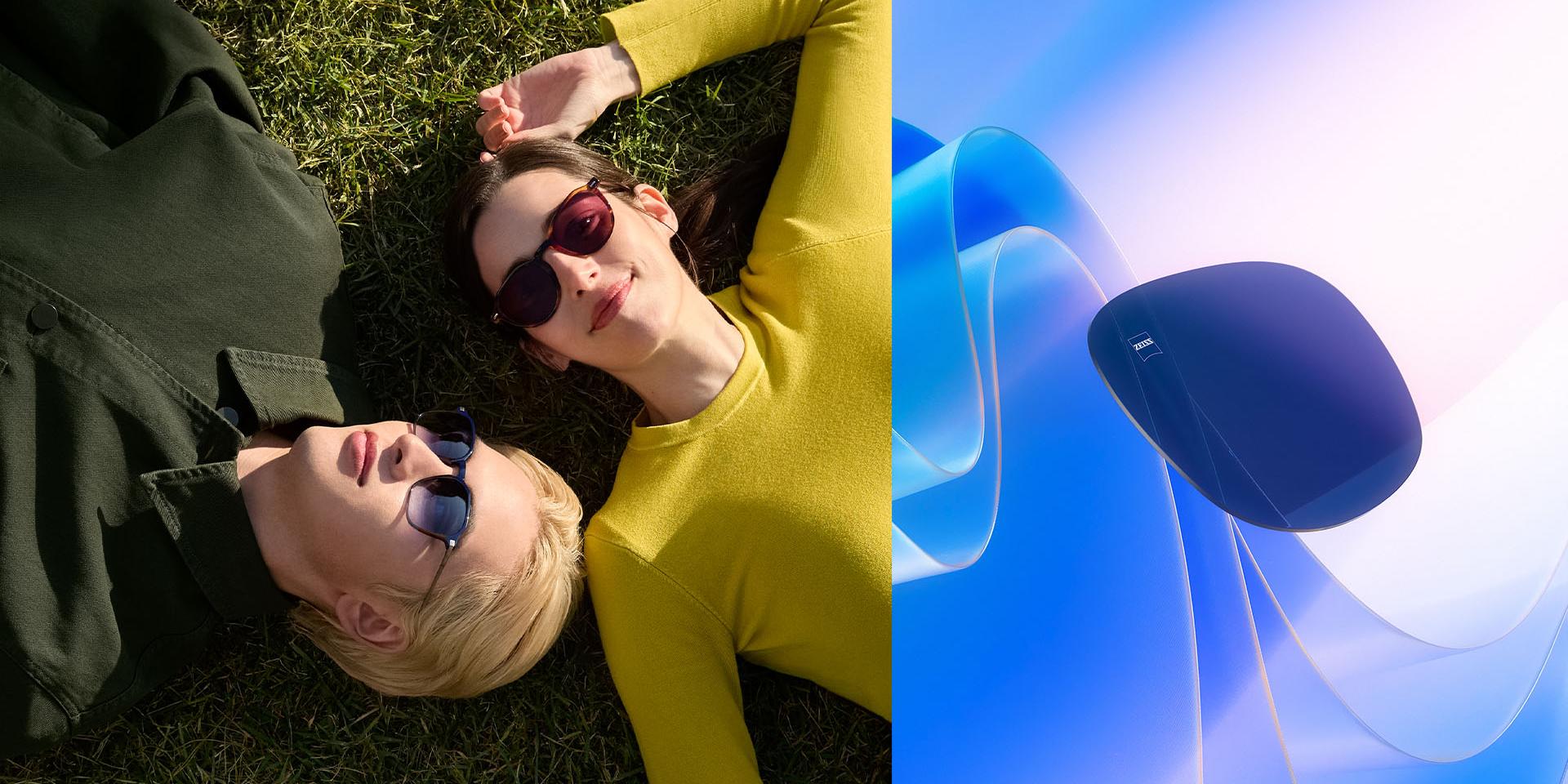 Mand og kvinde der bærer ZEISS solbriller med styrke, slapper af på græsset og kigger op på himlen. Der vises en CGI-illustration af et farvet brilleglas, der svæver hen imod sollys til visning af dets evne til at blokere UV-stråler