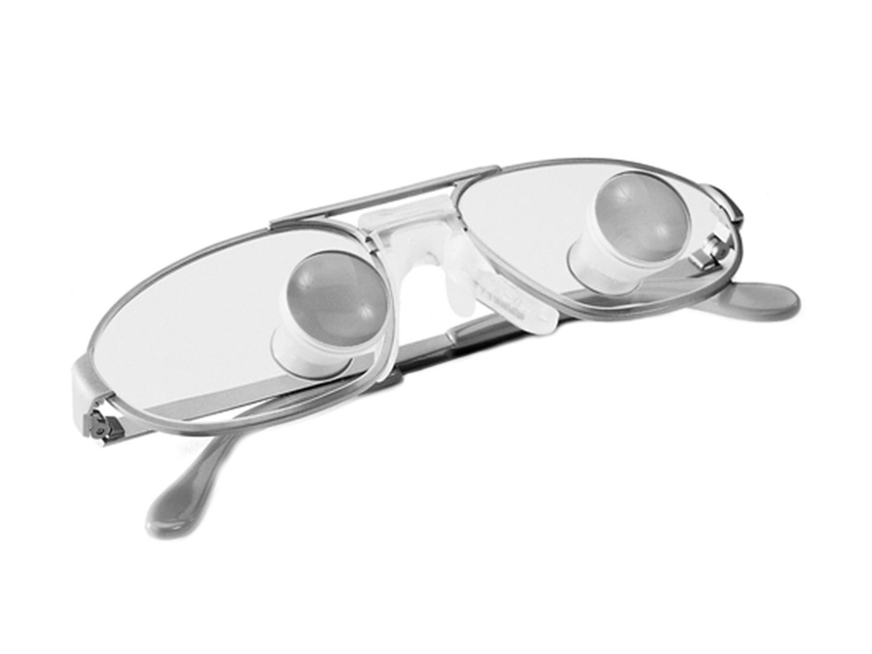 Brilleglas med et bånd og ZEISS kikkertlupbriller monteret direkte på glassene.